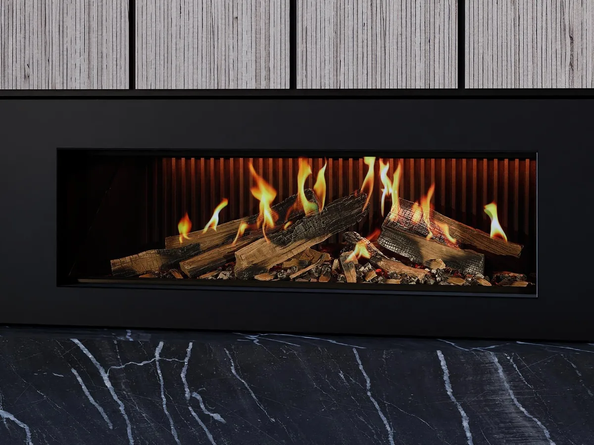 Ambiance Luxus e50 electric fireplace set into a black marble wall