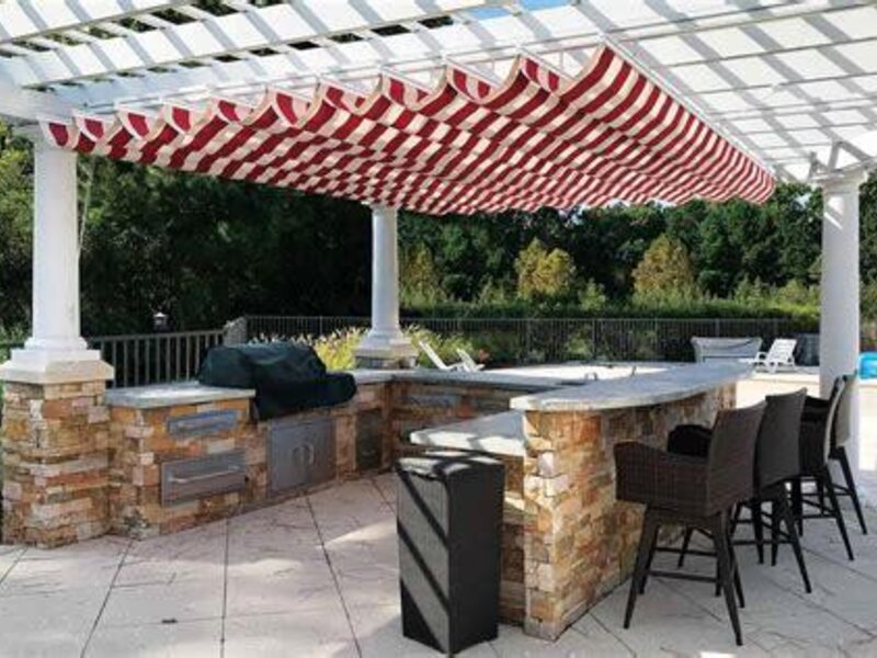 Aristocrat fabric canopy and pergola over a patio