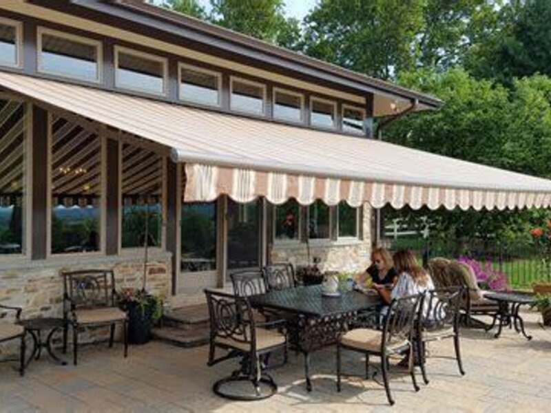 Aristocrat retractable awning shading a back deck — view 3