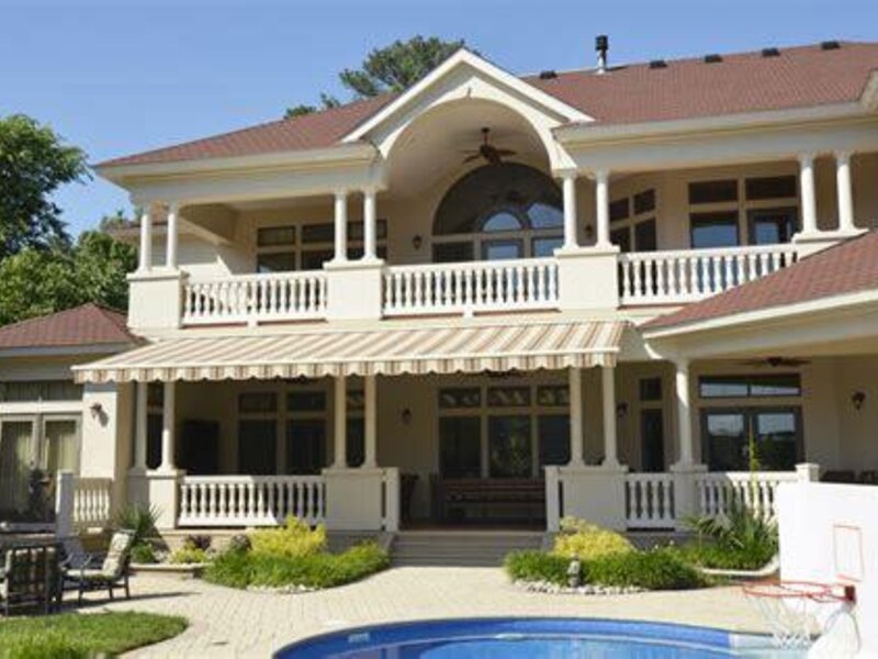 Aristocrat retractable awning shading a back deck — view 5