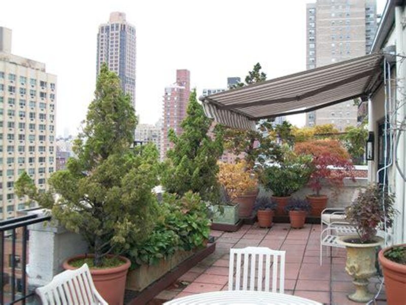 Aristocrat retractable awning shading a back deck — view 6