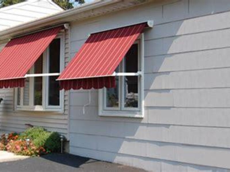 Aristocrat retractable window and porch awning on a house — view 2