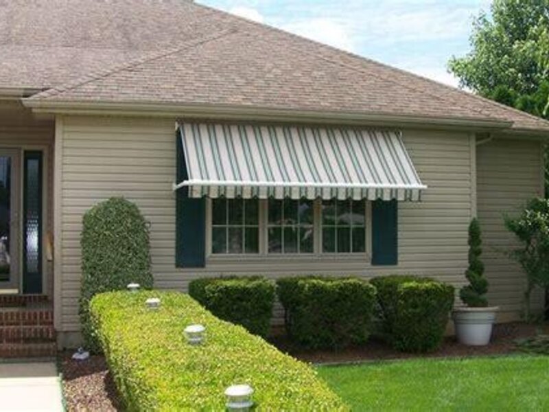 Aristocrat retractable window and porch awning on a house