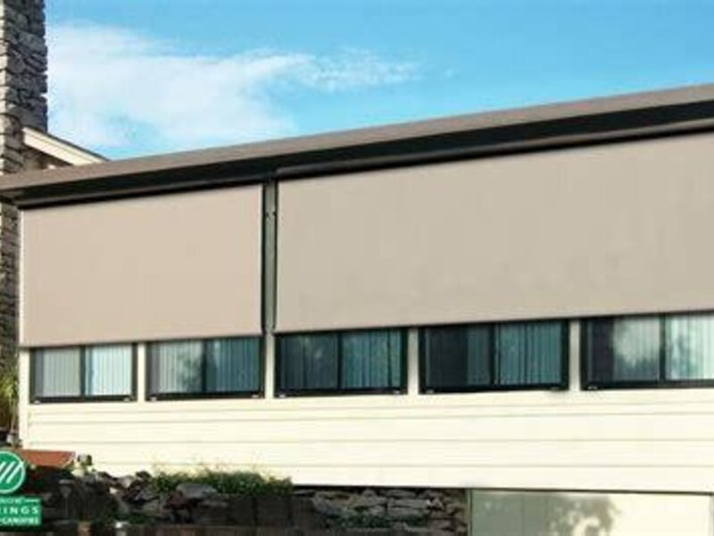 Aristocrat vertical window solar shades on a porch — view 2