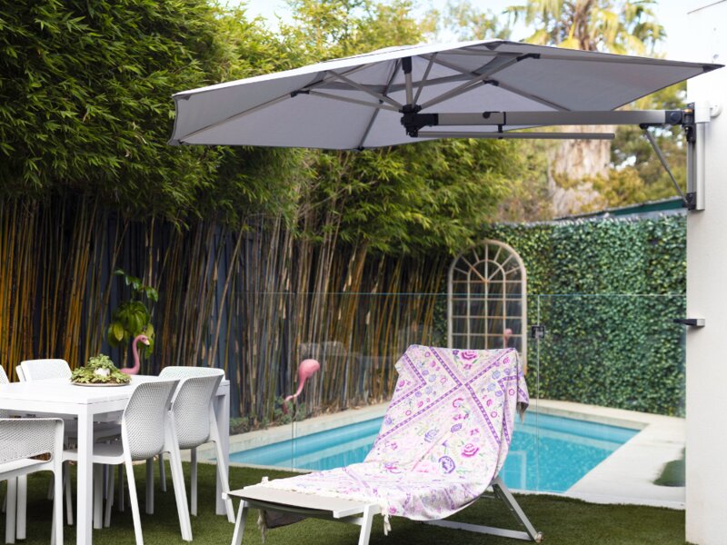 ShadowSpec Retreat single canopy shading a patio dining area — view 5