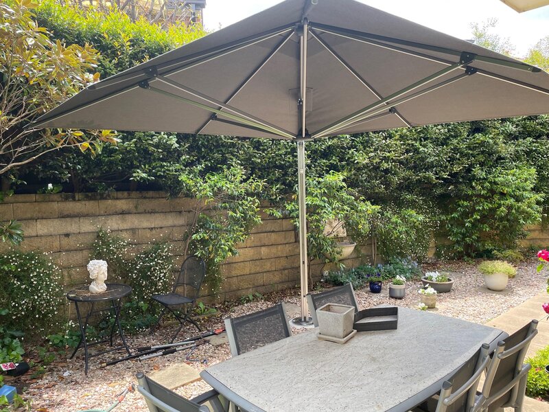 ShadowSpec Serenity single cantilever canopy shading an outdoor lounge — view 2