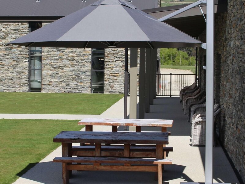 ShadowSpec Serenity single cantilever canopy shading an outdoor lounge — view 4
