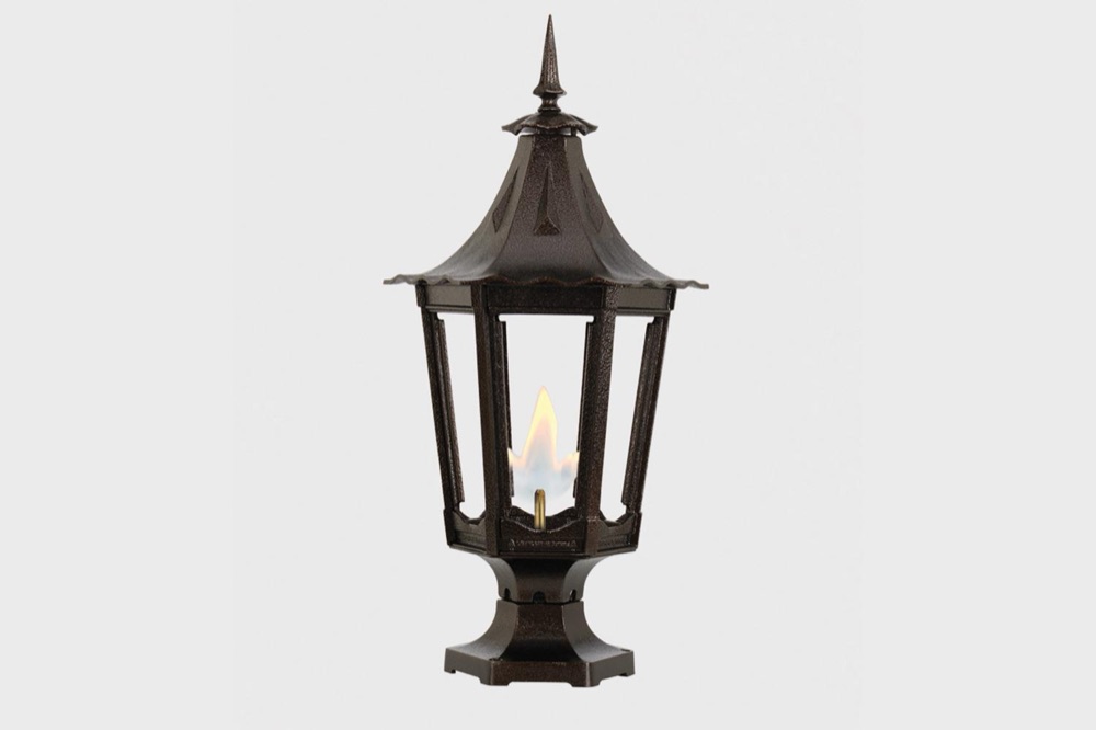 American Gas Lamp Works Cavalier copper lamp on a brick wall