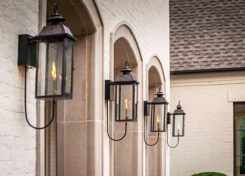 Legendary Lighting Apollo copper gas lantern on a stone wall — view 2