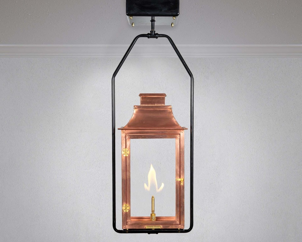 Legendary Lighting Apollo copper gas lantern on a stone wall — view 4