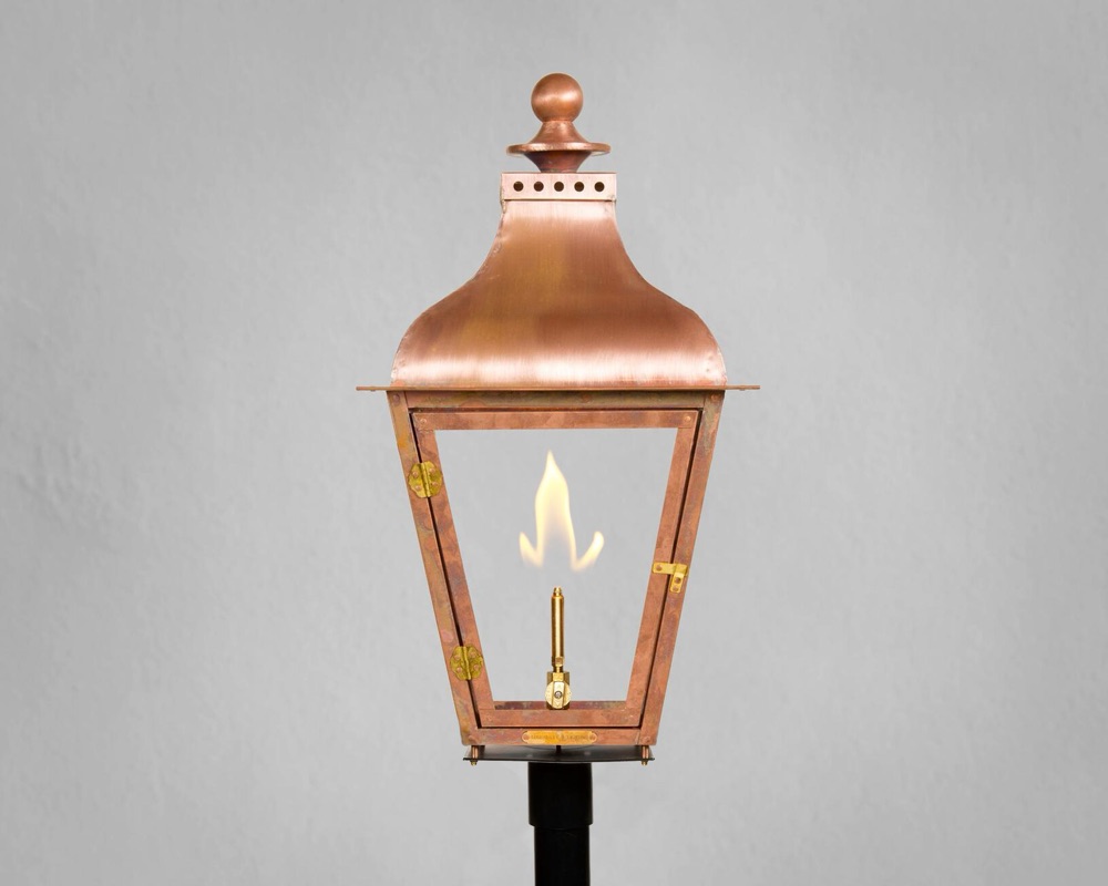 Legendary Lighting Apollo copper gas lantern on a stone wall — view 5