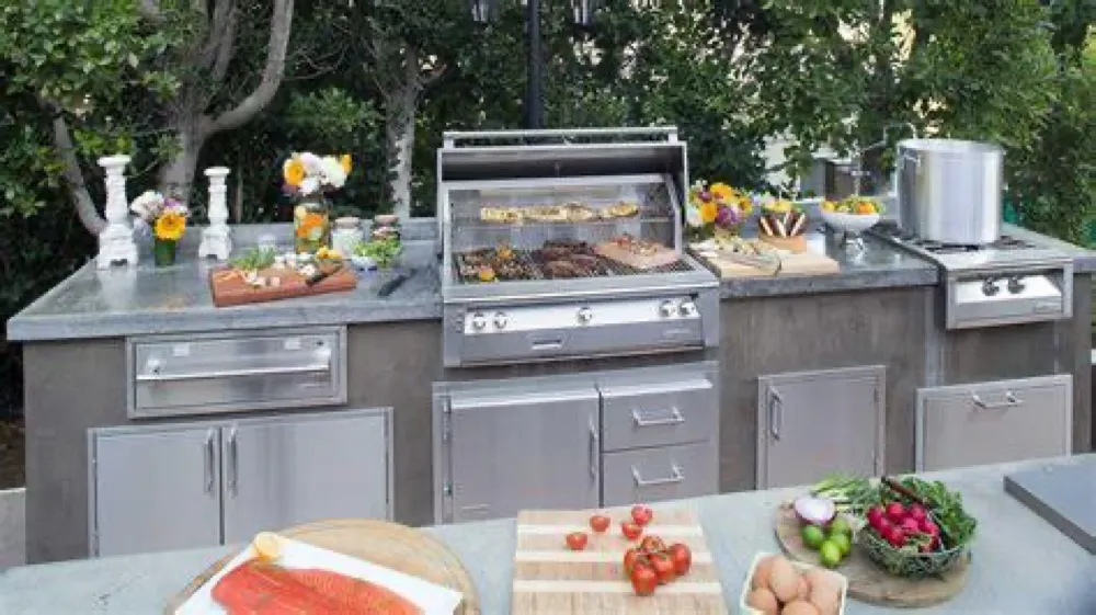 Built-in gas grill in a stainless outdoor kitchen island