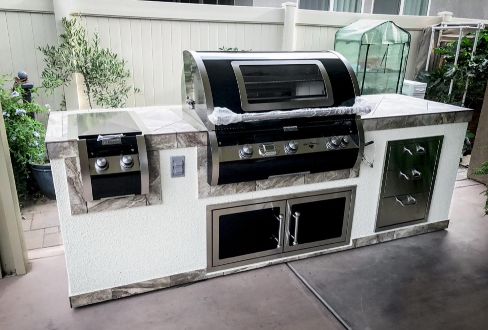 Fire Magic Echelon built-in gas grill in a custom outdoor kitchen