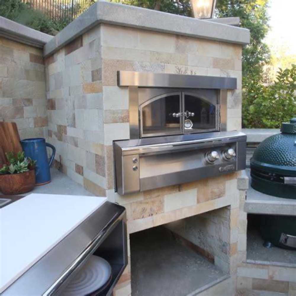 Alfresco built-in gas pizza oven in a stainless outdoor kitchen
