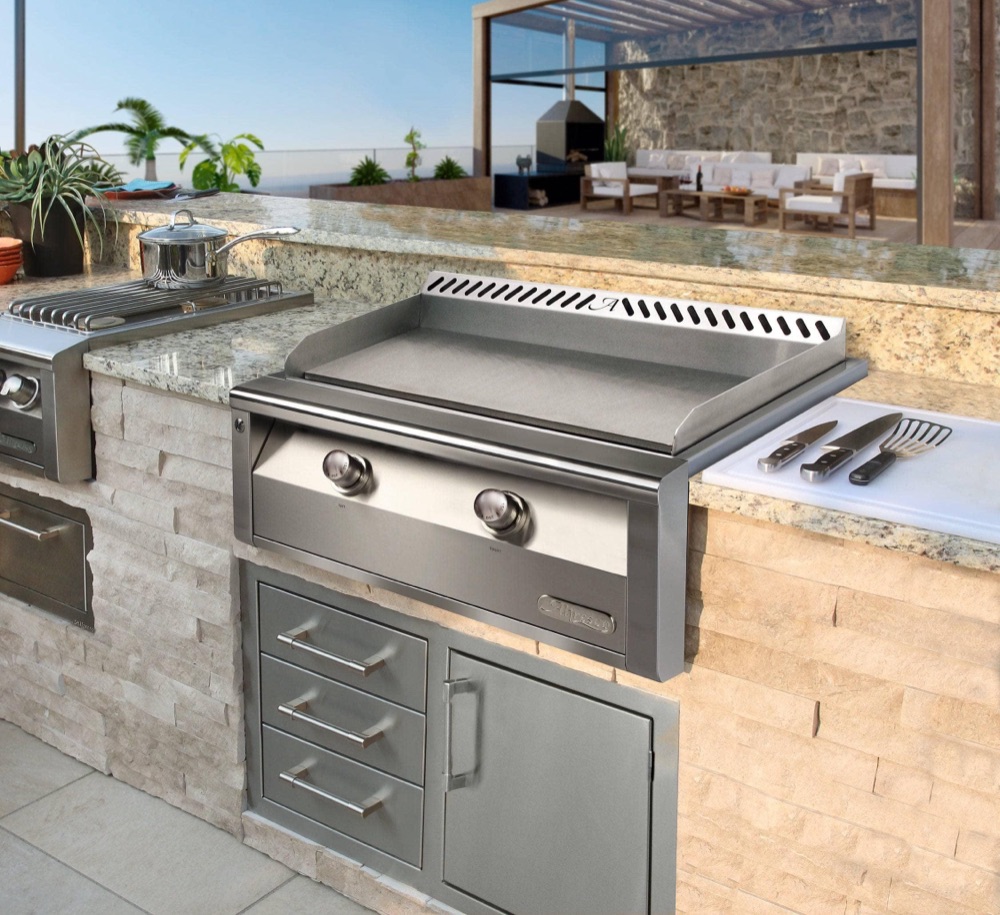 Alfresco outdoor refrigerator drawers in a stainless kitchen island — view 2