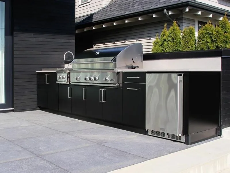 Stainless outdoor kitchen island with built-in grill