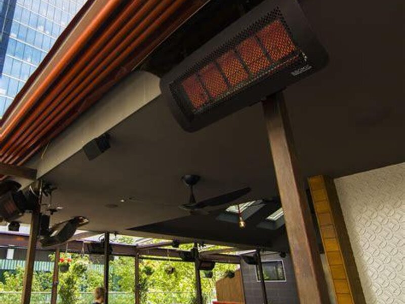 Bromic infrared gas patio heaters mounted under a patio roof — view 2