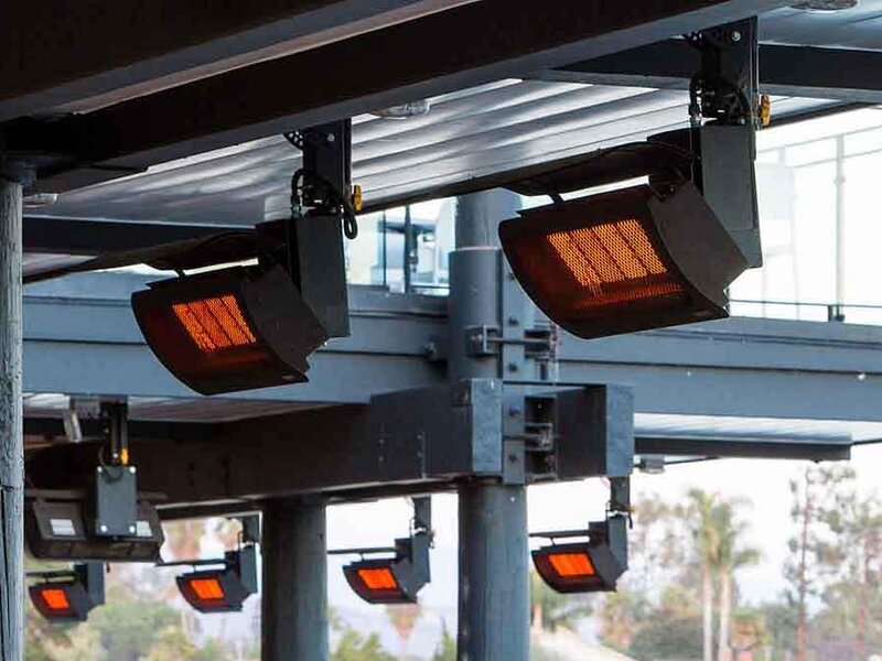 Bromic infrared gas patio heaters mounted under a patio roof