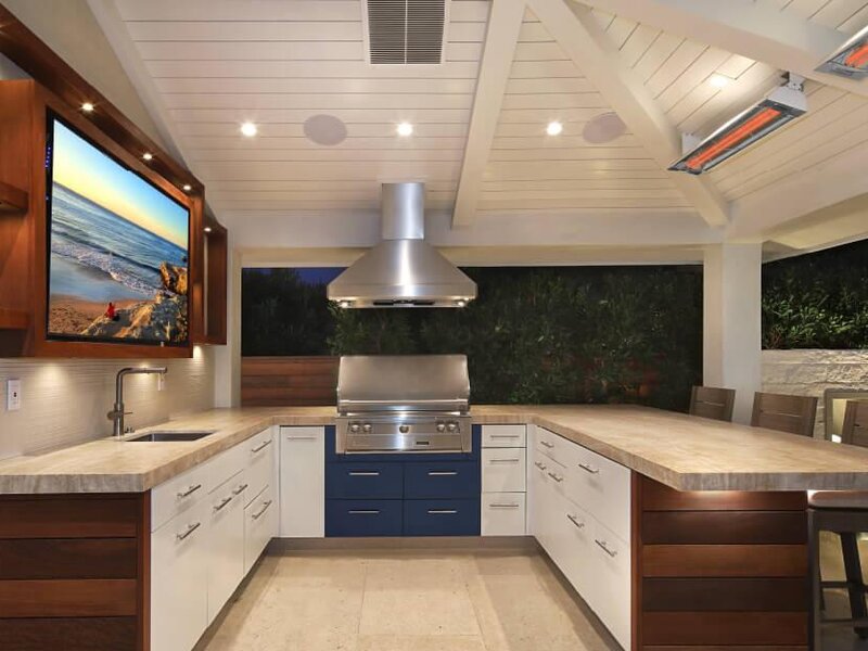Infratech infrared heaters glowing on a covered outdoor kitchen ceiling