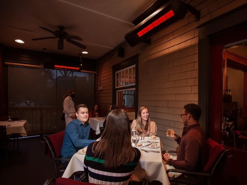 SunGlo overhead patio heaters warming an outdoor cafe seating area — view 2